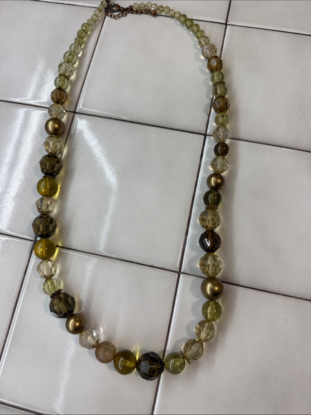 Vintage style beaded necklace. Olive green topaz and gold .